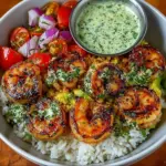 Shrimp avocado rice bowl with cilantro lime sauce served in a bowl