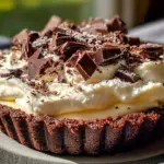 Decadent Cadbury Flake Mousse Tart topped with chocolate flakes