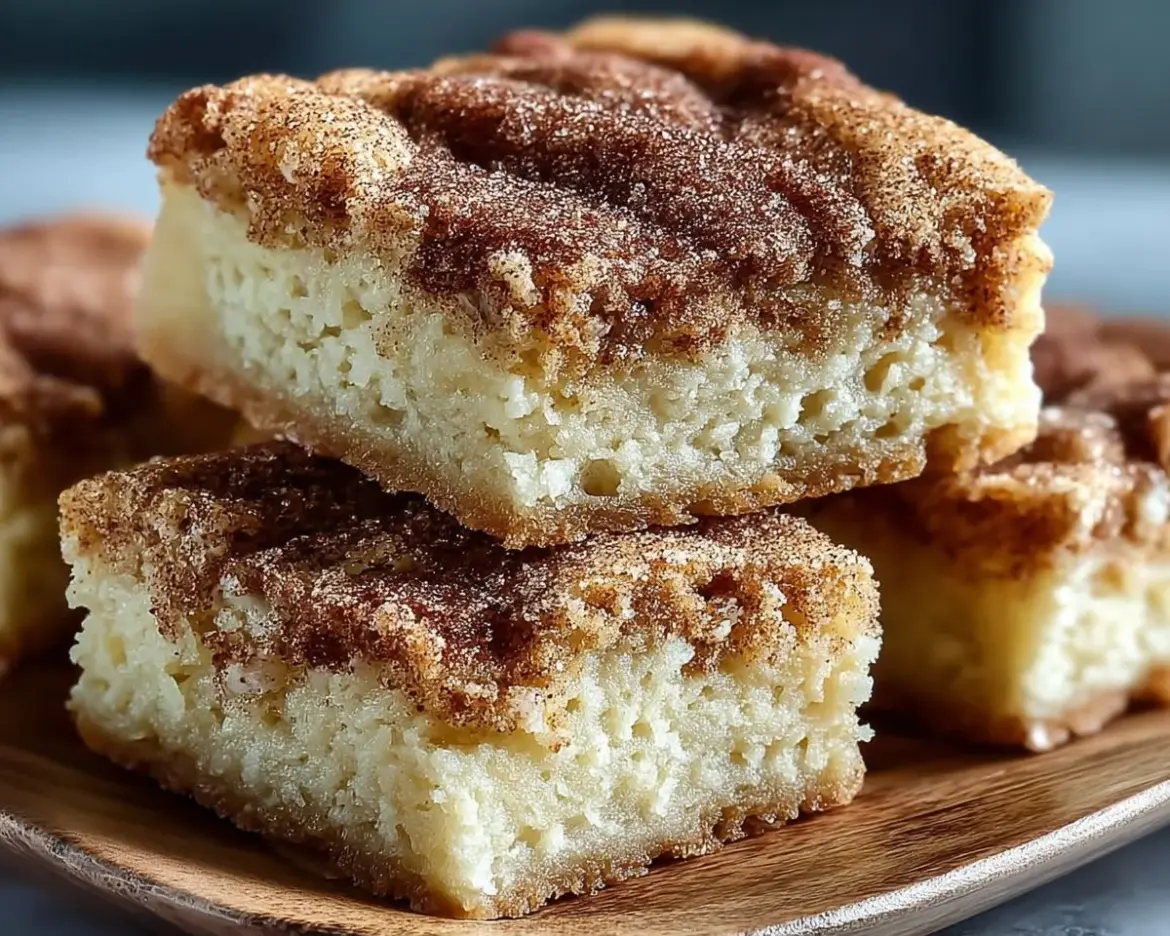 Chewy snickerdoodle cookie bars with cinnamon sugar topping