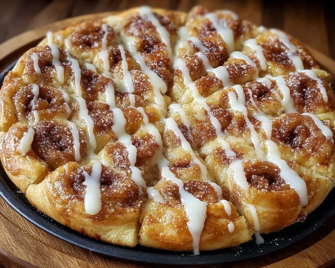 Cinnamon-sugar pizza made with crescent rolls, topped with sweet cinnamon and sugar.
