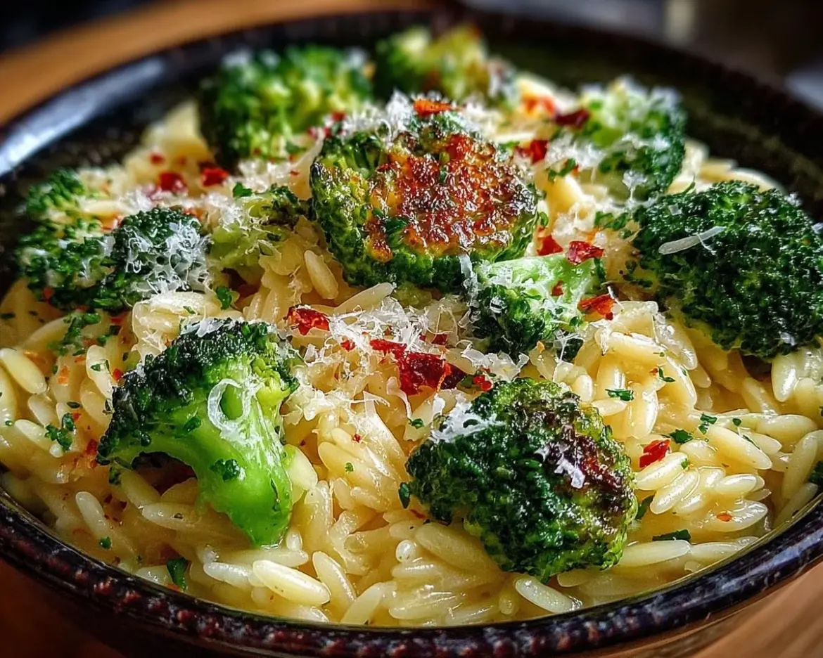 Creamy orzo with Parmesan broccoli in a bowl, garnished and ready to serve.