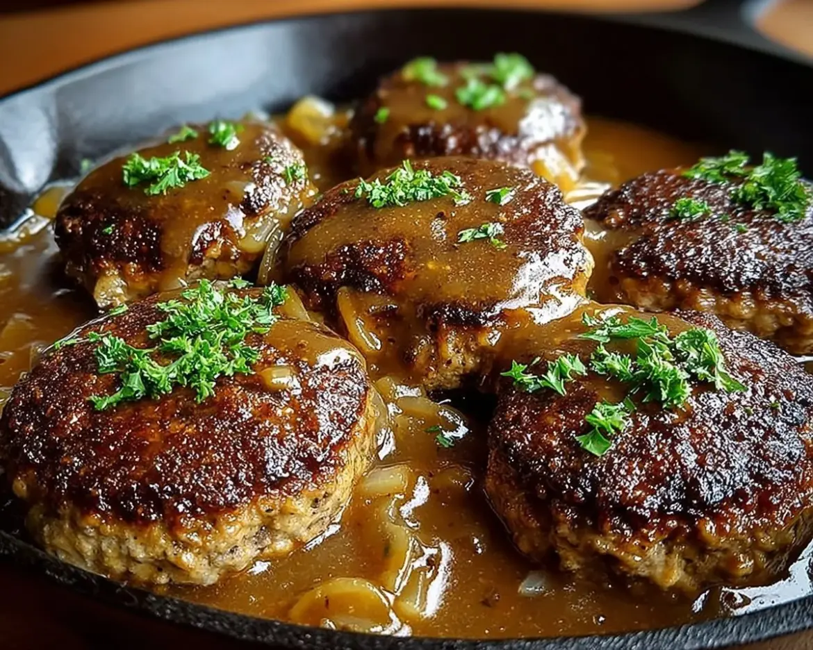Homemade delicious Salisbury steak served with gravy and sides