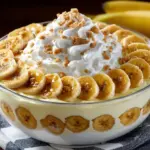 Delicious easy banana pudding served in a glass bowl with bananas on top