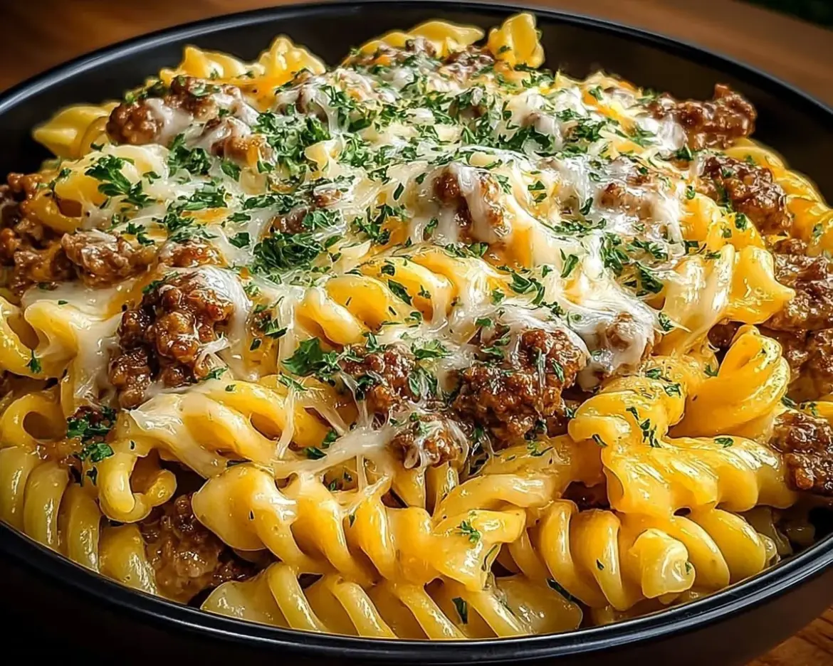 Creamy Loaded Cheeseburger Alfredo Pasta garnished with herbs and cheese