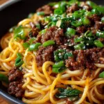 Mongolian Ground Beef Noodles served in a bowl with vegetables