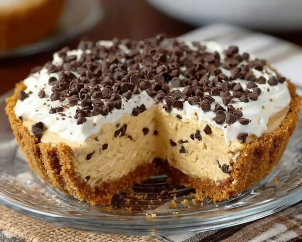 No bake pumpkin cheesecake topped with whipped cream and pumpkin spice