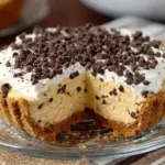 No bake pumpkin cheesecake topped with whipped cream and pumpkin spice