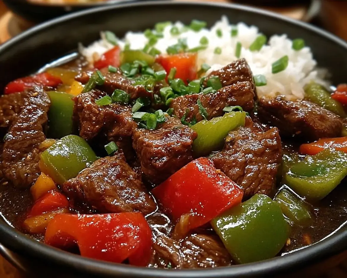 Delicious Pepper Steak cooked in a Crock Pot with vegetables and spices.