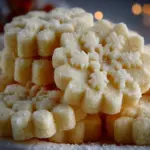 Freshly baked shortbread cookies on a cooling rack.